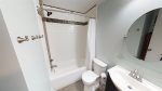 Bathroom with pedestal sink basin and tub/shower combination 